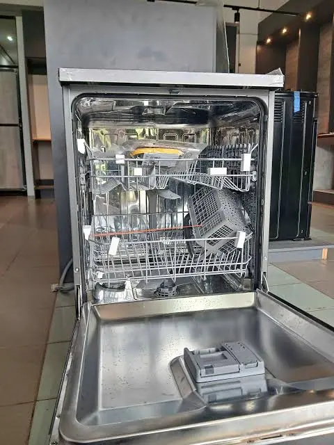 Dishwasher door opened for repair in Al Quoz