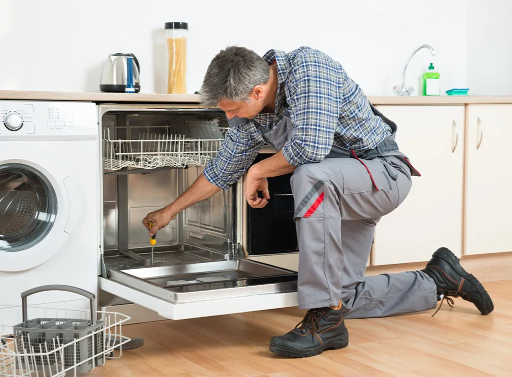 Fixerman technician inspecting a dishwasher in Dubai