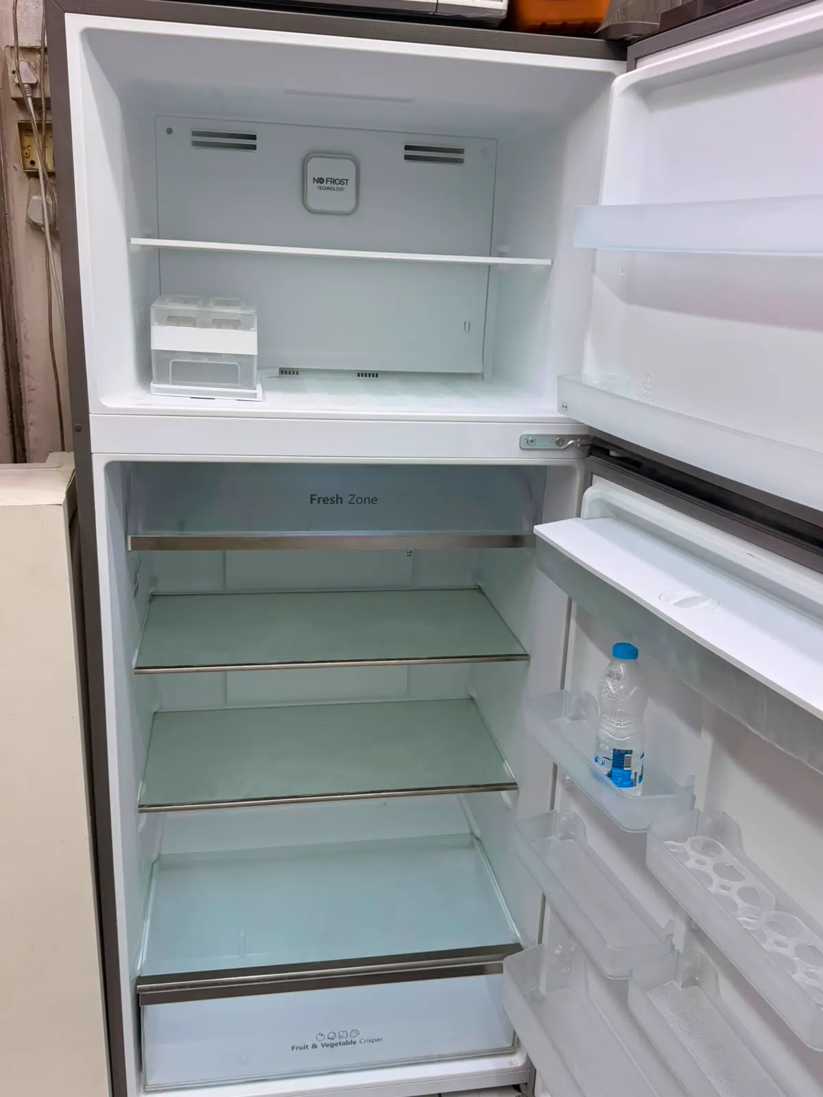 Refrigerator door opened for repair in Al Barsha