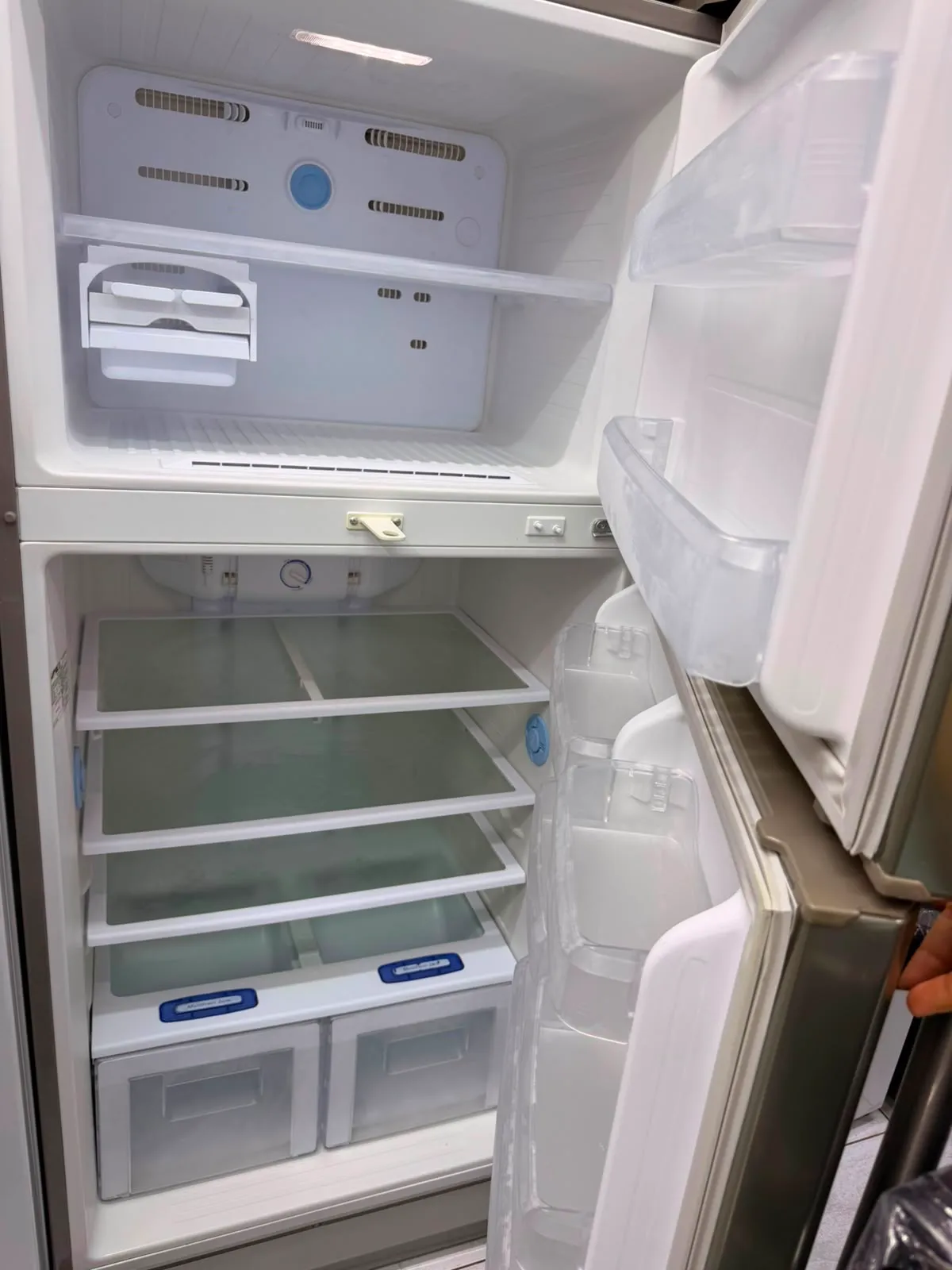 Refrigerator being repaired in a Dubai kitchen